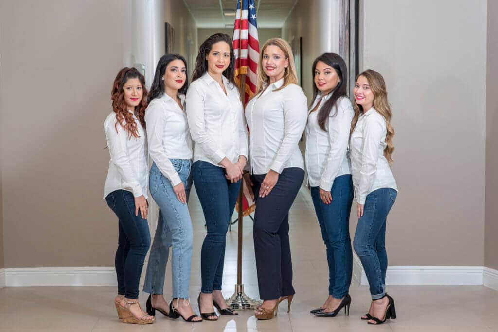 photo of attorney Sandra Echevarria and her professional staff